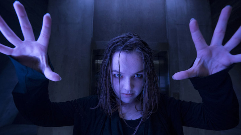 Aislinn Paul as Phoebe with hands splayed out in front of her in Heroes Reborn