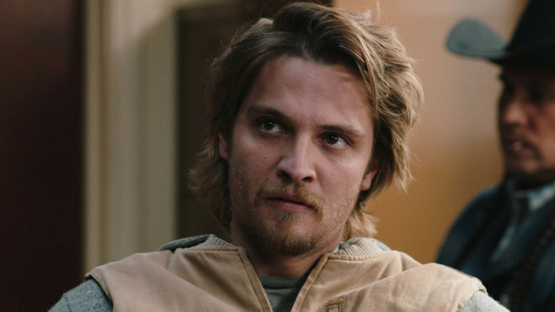 Kayce (Luke Grimes) sitting down on "Yellowstone."