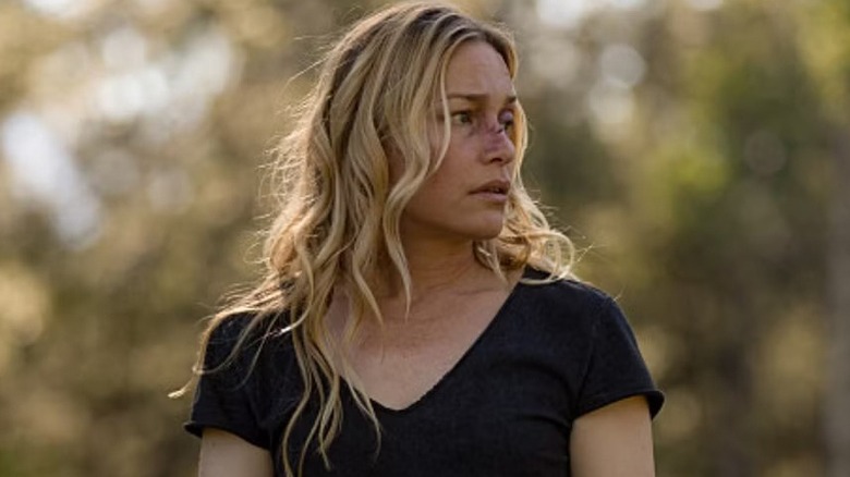 Summer (Piper Perabo) standing in a field on "Yellowstone."