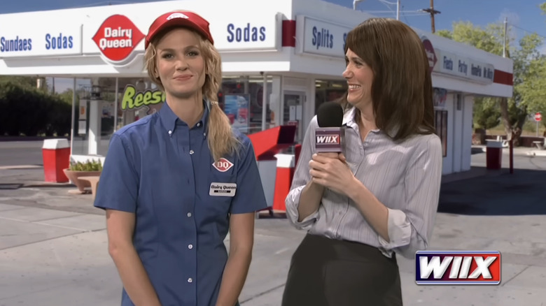 January Jones standing next to Kristen Wiig in an SNL sketch