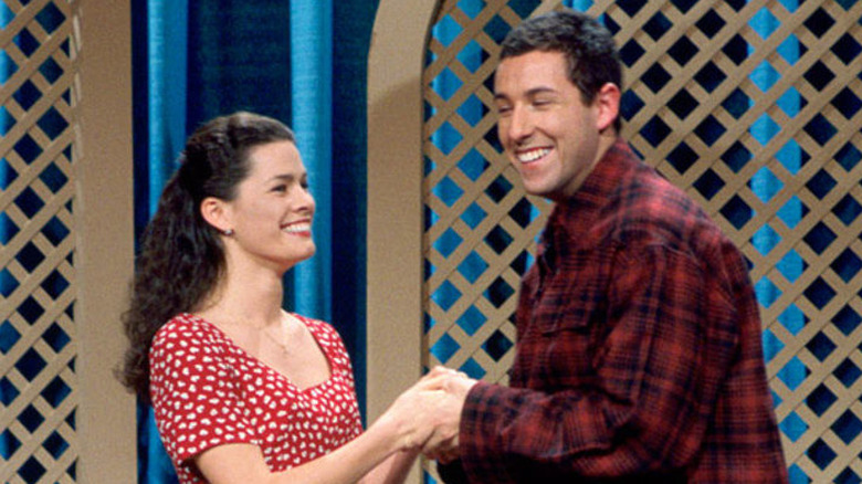 Nancy Kerrigan holding hands with Adam Sandler on SNL