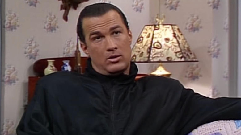 Steven Seagal sitting on a couch on SNL