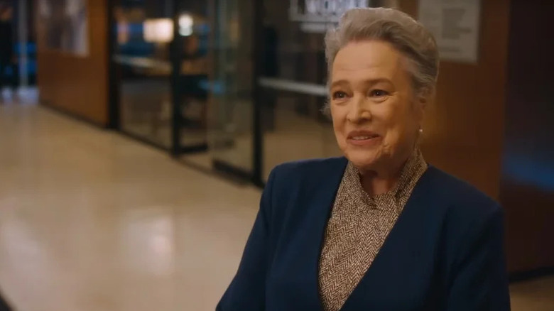 Madeline Kingston (Kathy Bates) stands smiling in an office on Matlock (2024)