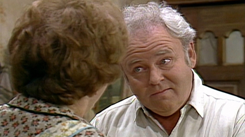Archie Bunker (Carroll O'Connor) staring at Edith Bunker (Jean Stapleton) on All in the Family