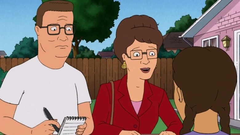 Peggy Hill wearing a red blazer on King of the Hill