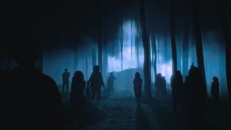 Shadowy figures standing in the forest on Joko Anwar's Nightmares and Daydreams