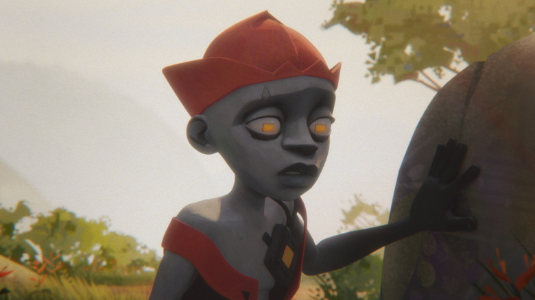 Luo leaning on a rock on Kizazi Moto: Generation Fire