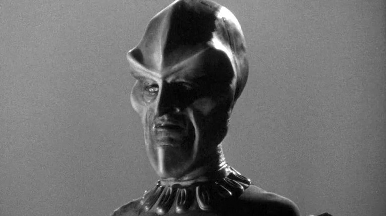 An Ebonite interrogator looking stern on The Outer Limits
