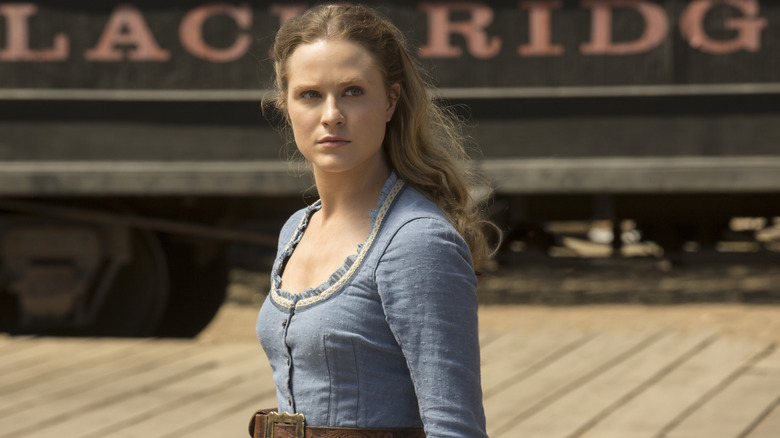 Dolores Abernathy (Evan Rachel Wood) stands on a Wild West train platform in Westworld