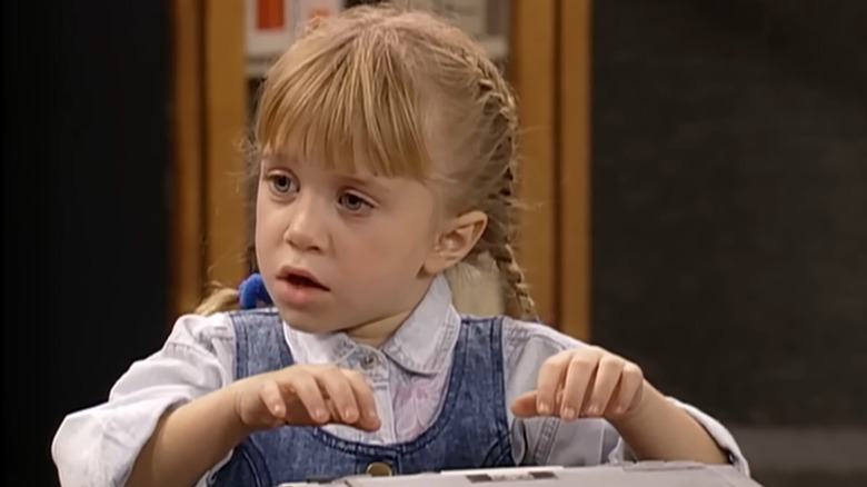 Mary-Kate and Ashley Olsen's Michelle Tanner looking to the side in Full House