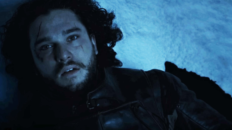 Kit Harrington as Jon Snow lies on the snow in Game of Thrones