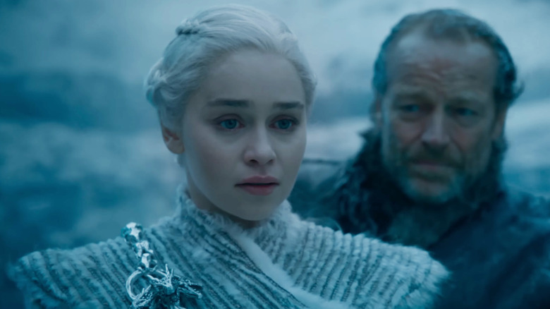 Emilia Clarke as Daenerys Targaryen stands in the snow in Game of Thrones