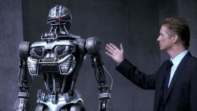 Daniel Graystone (Eric Stoltz) shows off a Cylon in Caprica
