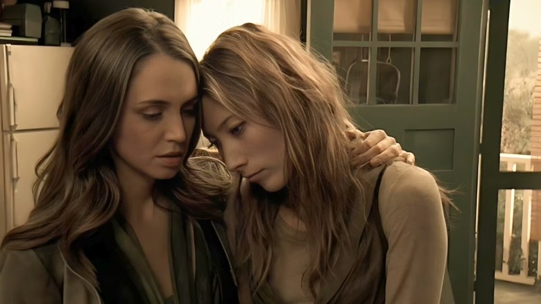 Echo (Eliza Dushku) and Sierra (Dichen Lachman) rest their heads together comfortingly in Dollhouse