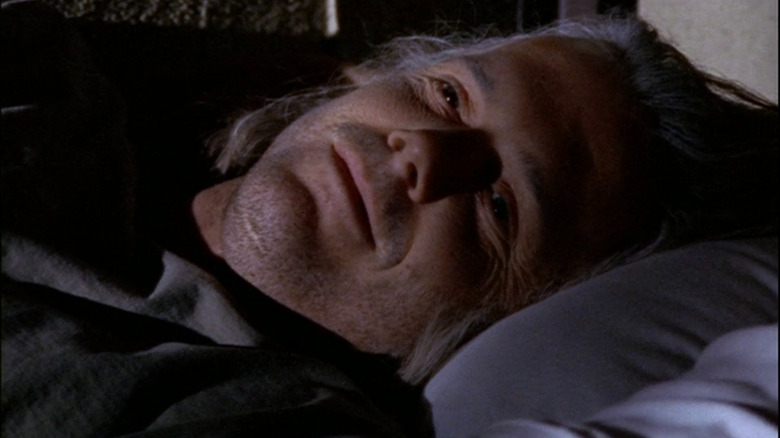 Cyril (Scott William Winters) lying in bed on Oz