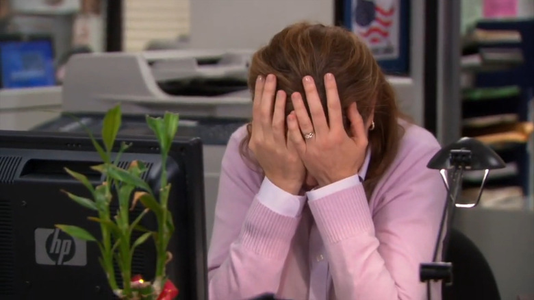 Pam (Jenna Fischer) covering her face on The Office