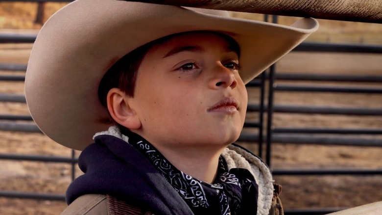 Tate Dutton looks out from under his cowboy hat in Yellowstone
