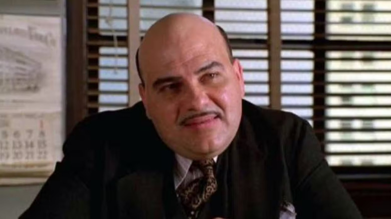 Jon Polito as Detective Steven Crosetti sits in front of a window on Homicide: Life on the Street