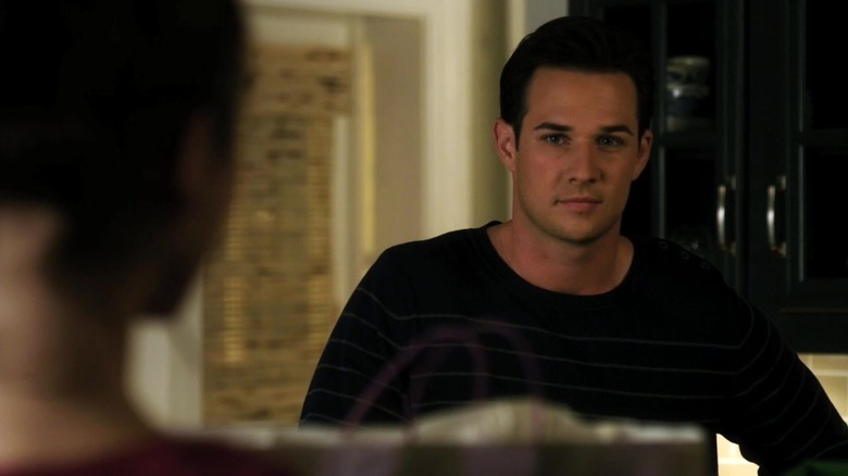 Carlo Marks as Ian Thomas smirking in Pretty Little Liars