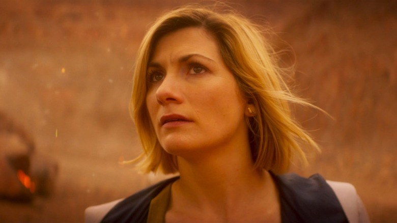 Jodie Whittaker as the Doctor with orange-ish background in Doctor Who