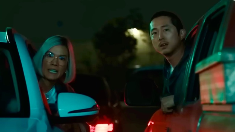 Amy Lau and Danny Cho screaming out the windows of their cars
