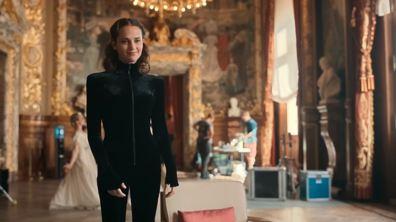 Mira Harberg standing and smiling