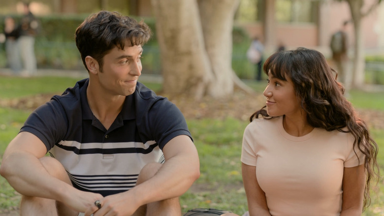 Benny and Carmen smiling at each other