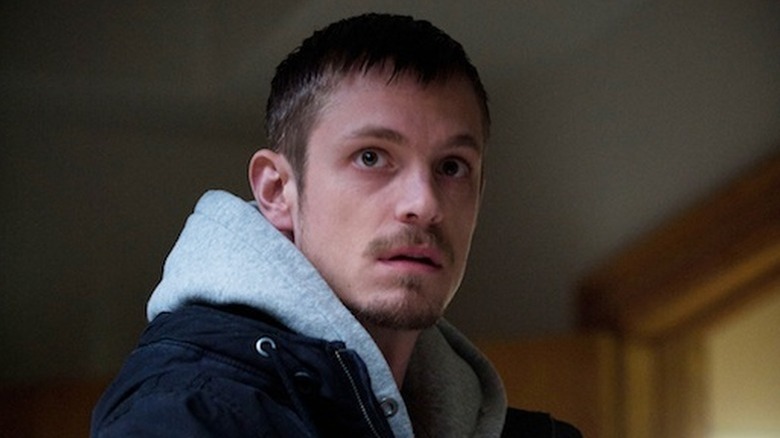 An inquisitive Stephen Holder (Joel Kinnaman) glances up in The Killing