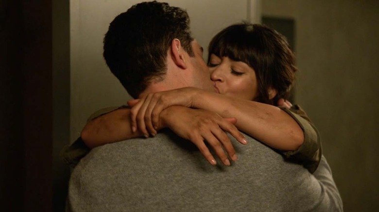 Schmidt (Max Greenfield) and Cece Parekh (Hannah Simone) passionately kiss in New Girl