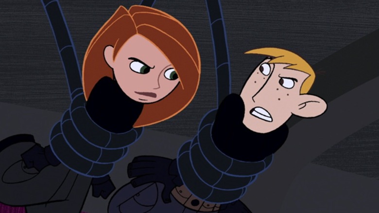 Kim Possible and Ron Stoppable trapped in wires looking at each other in Kim Possible
