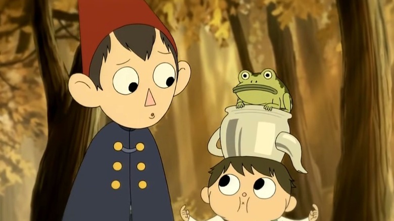 Wirt looking at Greg with a frog on his head in Over the Garden Wall