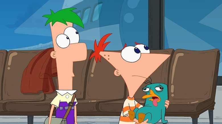 Ferb and Phineas looking concerned holding an incapacitated Perry the Platypus in Phineas and Ferb