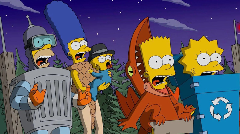Homer Simpson dressed as Bender, Marge Simpson dressed as a waffle cone holding Maggie dressed as Charlie Chaplin, Bart dressed as a dinosaur and Lisa dressed as a recycling bin all looking scared in The Simpsons