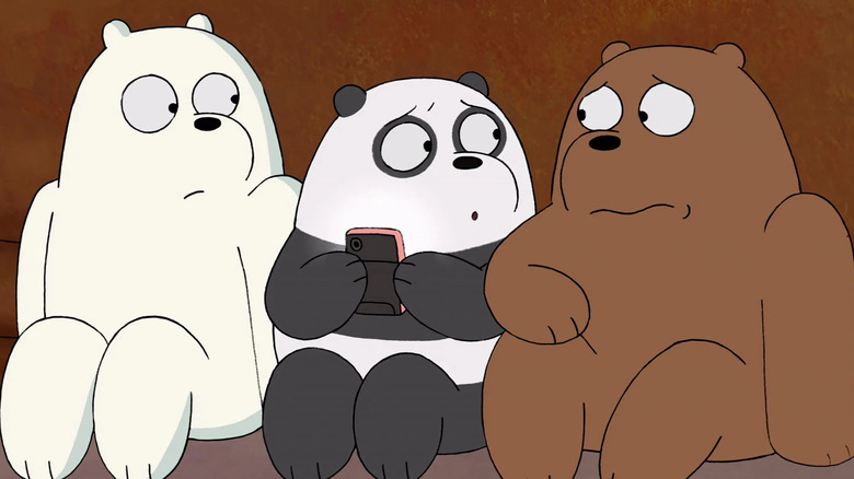 Ice Bear, Panda holding a phone, and Grizzly looking scared together in We Bare Bears