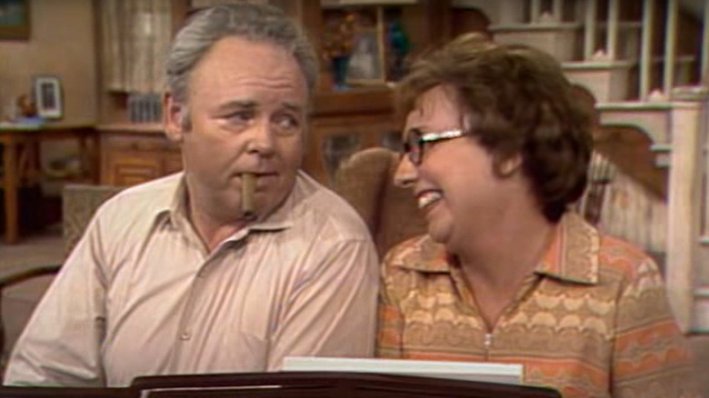 Archie Bunker (Carol O'Connor) and Edith Bunker (Jean Stapleton) sing the theme song to All in the Family