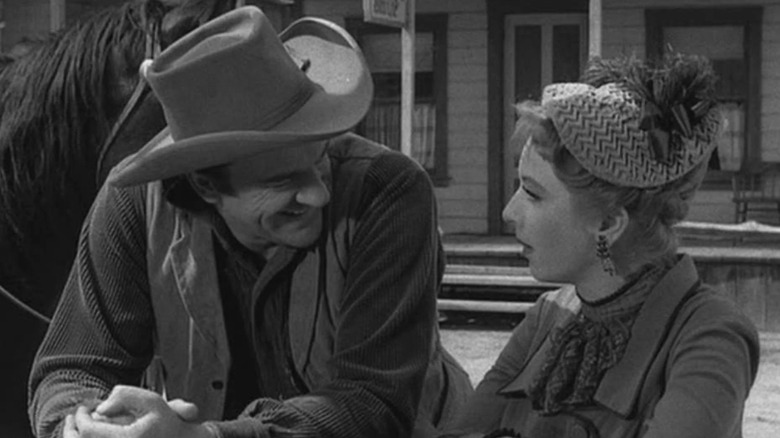 Marshal Matt Dillon (James Arness) talks to Miss Kitty Russell (Amanda Blake) in Gunsmoke