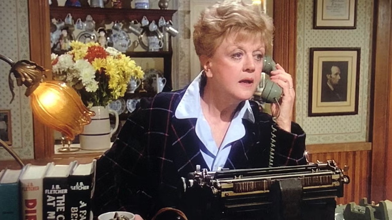 Jessica Fletcher (Angela Lansbury) answers the phone in Murder, She Wrote