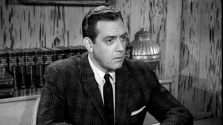 Perry Mason (Raymond Burr) takes in information in Perry Mason