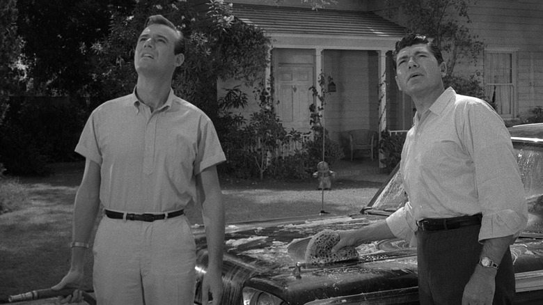 Don Martin (Burt Metcalfe) and Steve Brand (Claude Akins) look to the sky in The Twilight Zone episode The Monsters Are Due on Maple Street