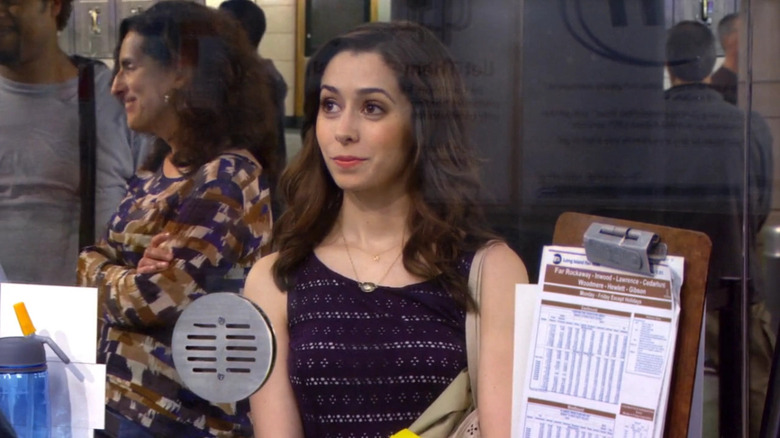 Cristin Milioti as Tracy McConnell smiling at a train station in How I Met Your Mother