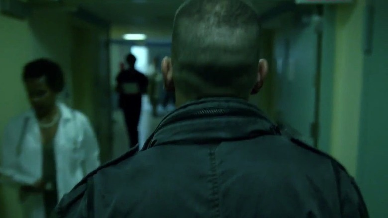 The back of Jon Bernthal's head as Frank Castle walks through a hospital hall in Daredevil