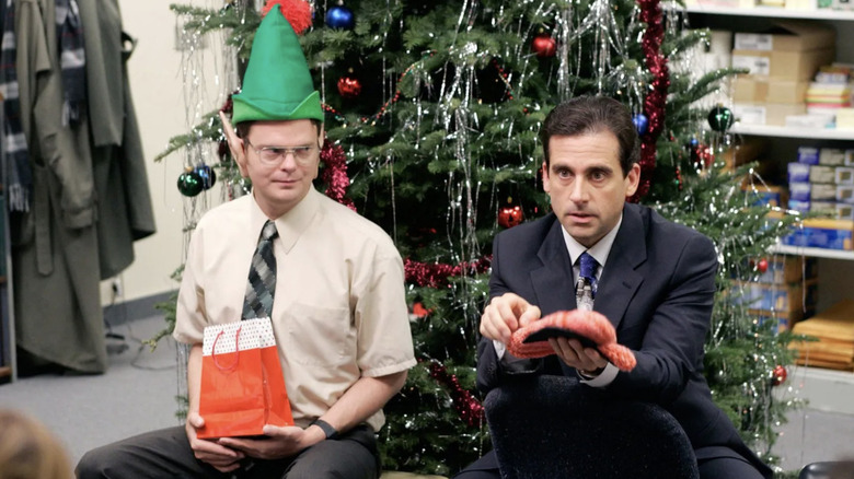 Dwight (Rainn Wilson) and Michael (Steve Carell) exchange gifts in The Office