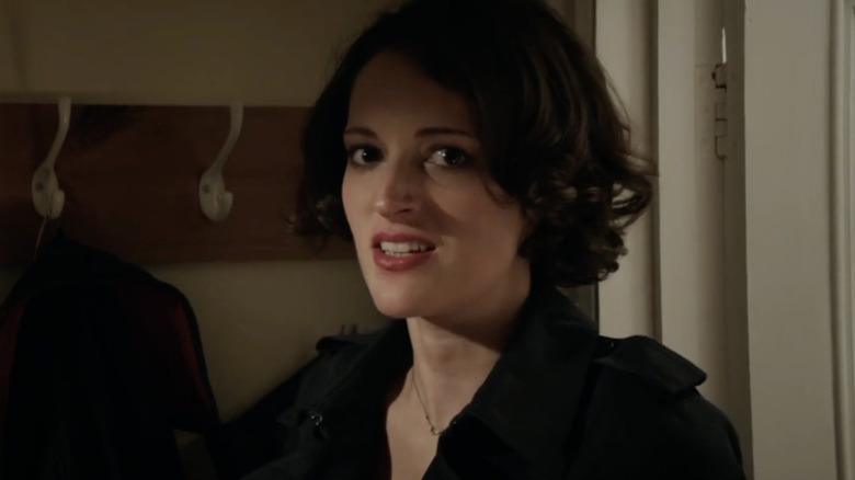 Phoebe Waller Bridge as Fleabag staring at the camera in a coat in Fleabag