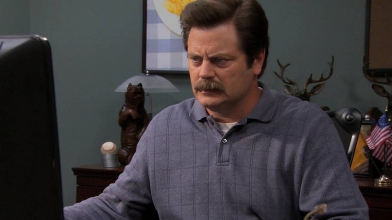 Nick Offerman as Ron Swanson staring angrily at his computer in Parks & Recreation