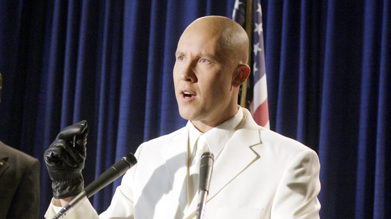 Michael Rosenbaum as Lex Luthor, giving a presidential address in Smallville.