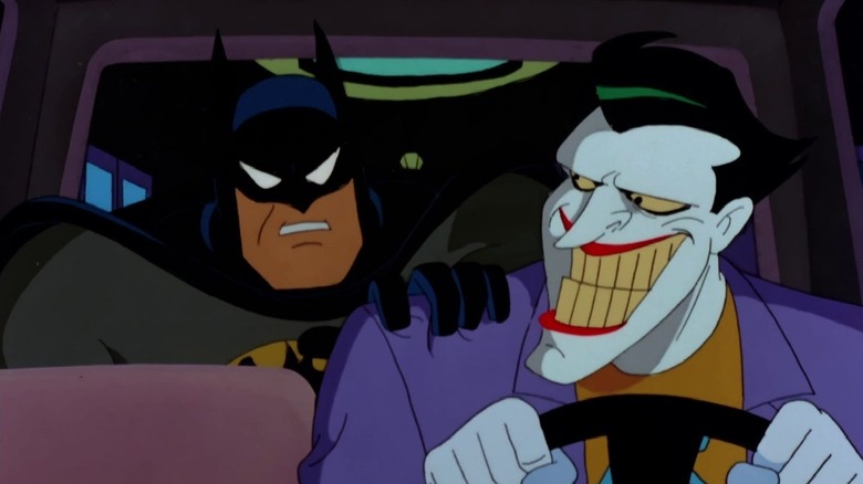 The Joker drives a car with Batman in the backseat in Batman: The Animated Series.