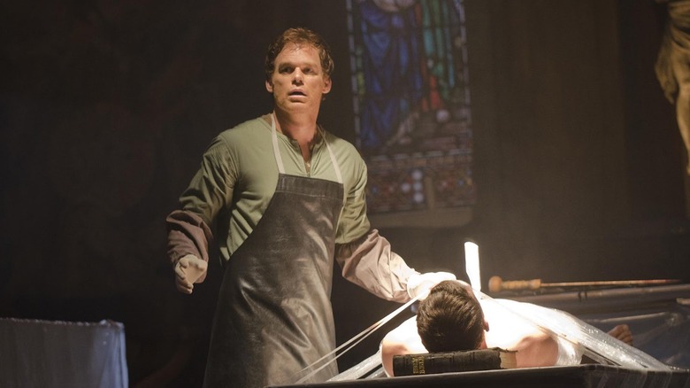 Michael C. Hall as Dexter Morgan, standing over a corpse in Dexter.