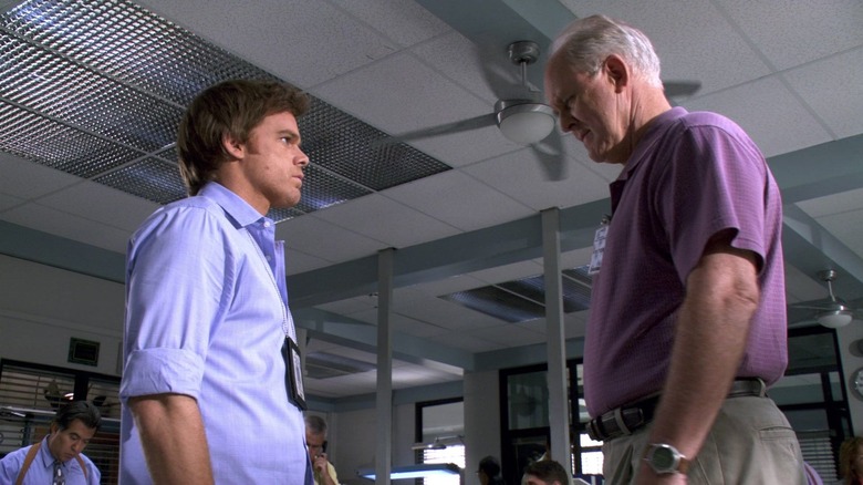 Michael C. Hall and John Lithgow as Dexter Morgan and Arthur Mitchell, confronting each other in Miami Metro in Dexter.