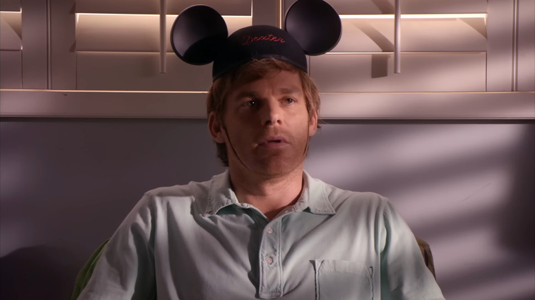 Michael C. Hall as Dexter Morgan, wearing mickey mouse ears in Dexter.