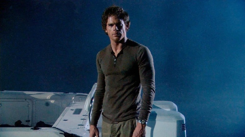 Michael C. Hall as Dexter Morgan, standing in front of his boat in Dexter.